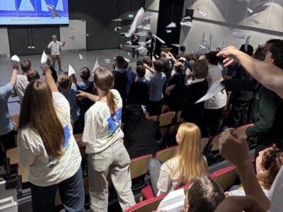 15 - Derek being showered by 100 paper aeroplanes as the event kicks off